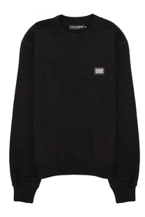 Dolce &amp; Gabbana men’s black sweatshirt featuring a rectangular metallic patch on the chest in cotton fabric
