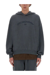 Dolce &amp; Gabbana men’s grey oversized hoodie with brown ribbed hem and cuffs featuring embroidered logo across chest
