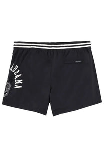 Dolce &amp; Gabbana men’s black swim trunks with white striped waistband and abanana logo on the side