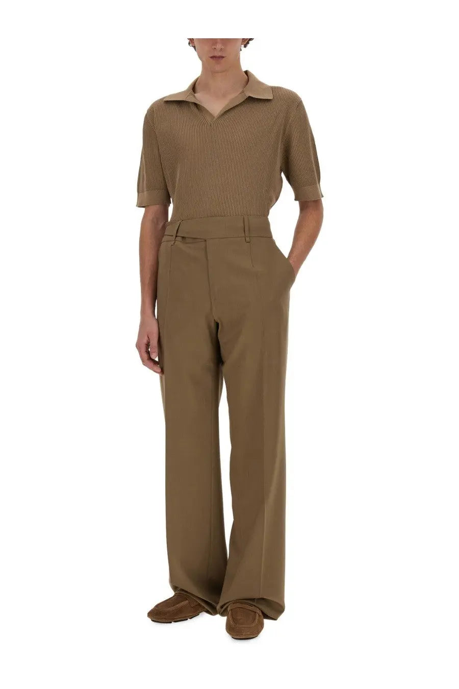 A beige short-sleeved polo shirt with fine vertical stripes and collar paired with Dolce &amp; Gabbana men’s tailored pants