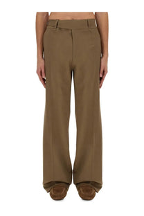 Dolce &amp; Gabbana men’s tailored beige wide-leg trousers with structured fit and clean creases in tan fabric
