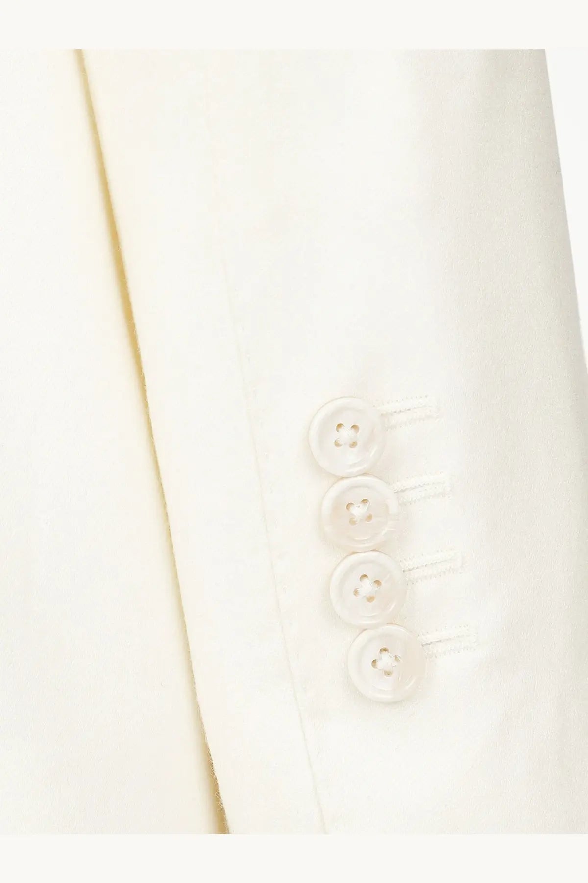 A row of four translucent buttons on the cream linen sleeve of the dolce &amp; gabbana men’s taormina blazer white