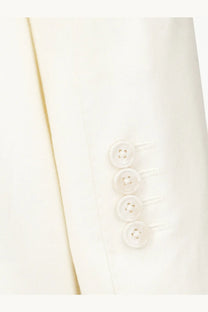 A row of four translucent buttons on the cream linen sleeve of the dolce &amp; gabbana men’s taormina blazer white