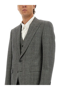 Dolce and gabbana men’s three piece grey suit featuring a gray plaid wool jacket with black buttons and notched lapel