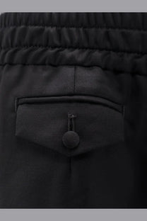 Dolce &amp; Gabbana men’s black virgin wool trousers with elastic waist textured fabric and front pocket button closure