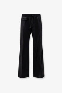 Black satin wide-leg trousers with drawstring waistband from Dolce &amp; Gabbana men’s virgin wool collection