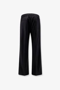 Dolce &amp; Gabbana men’s black virgin wool trousers with wide legs elastic waistband and subtle front pockets