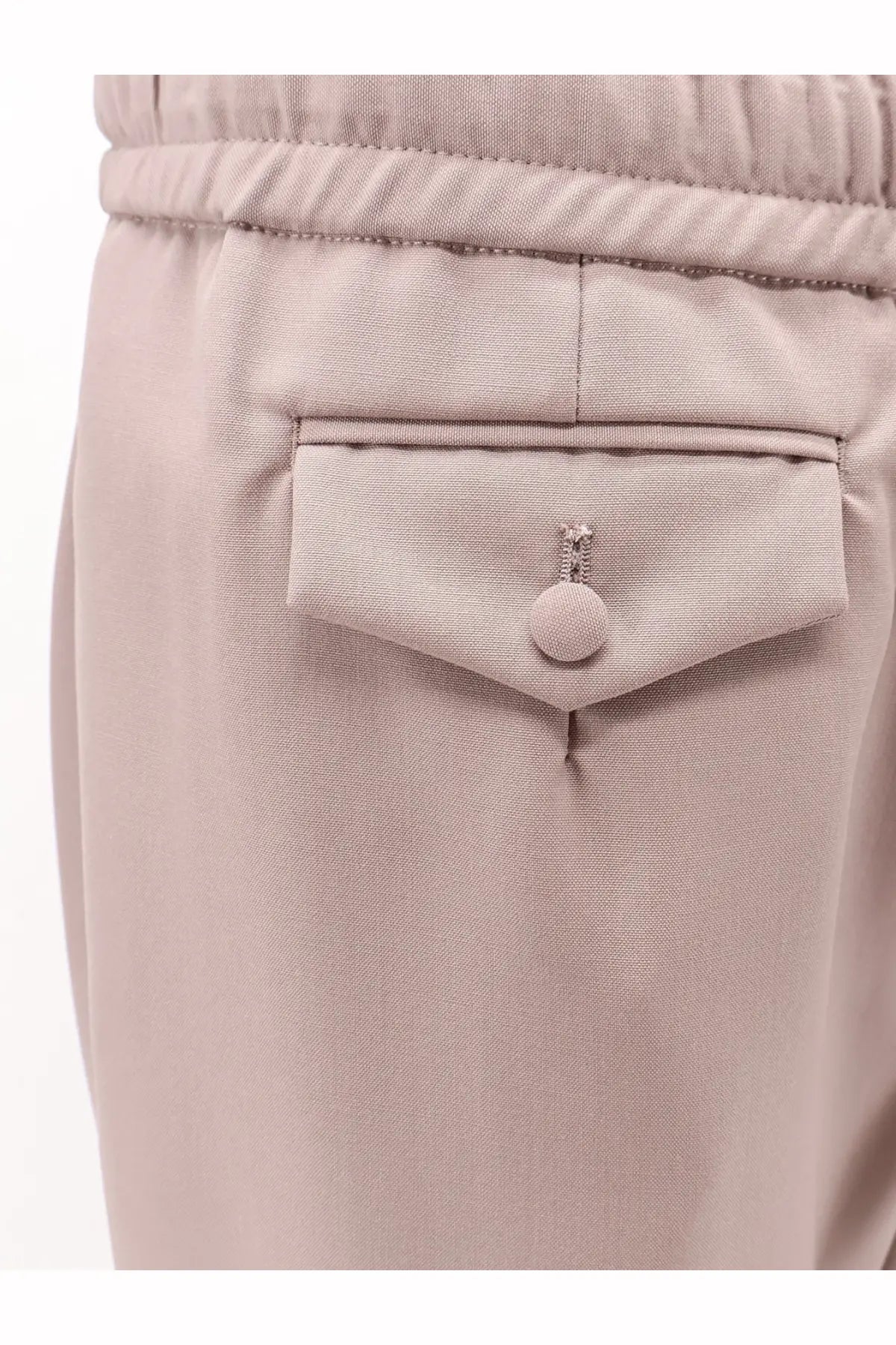 Beige dolce &amp; gabbana men’s virgin wool trousers featuring textured fabric and crystal embellished button on front pocket