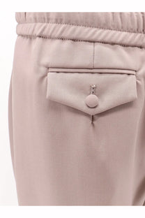 Beige dolce &amp; gabbana men’s virgin wool trousers featuring textured fabric and crystal embellished button on front pocket
