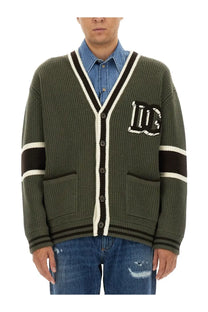 Dolce &amp; Gabbana men’s olive green wool cardigan with black and white striped v-neck, cuffs, placket, and dg logo patch