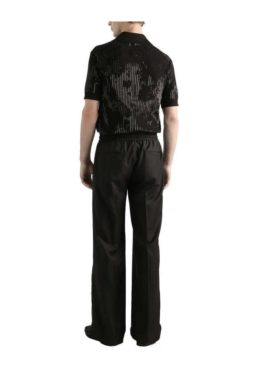 Black short-sleeved knit shirt with shimmering silver geometric pattern paired with dolce &amp; gabbana wool knit jogging pants