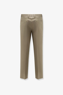 Beige satin dolce and gabbana men’s trousers with a sleek straight-leg cut and subtle back pleats shown from the back