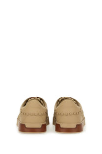 Dolce &amp; Gabbana men’s woven Portofino sneaker beige with beige leather, braided detailing, and brown rubber soles