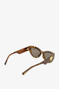 Dolce &amp; Gabbana women’s tortoiseshell acetate sunglasses with brown lenses and gold-tone lion emblem on the temple