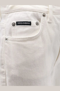 Dolce &amp; Gabbana women’s Audrey white denim trousers with silver metal buttons and black brand label visible
