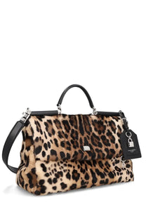 Dolce &amp; Gabbana women’s leopard print fur handbag with black leather handles and silver hardware accents
