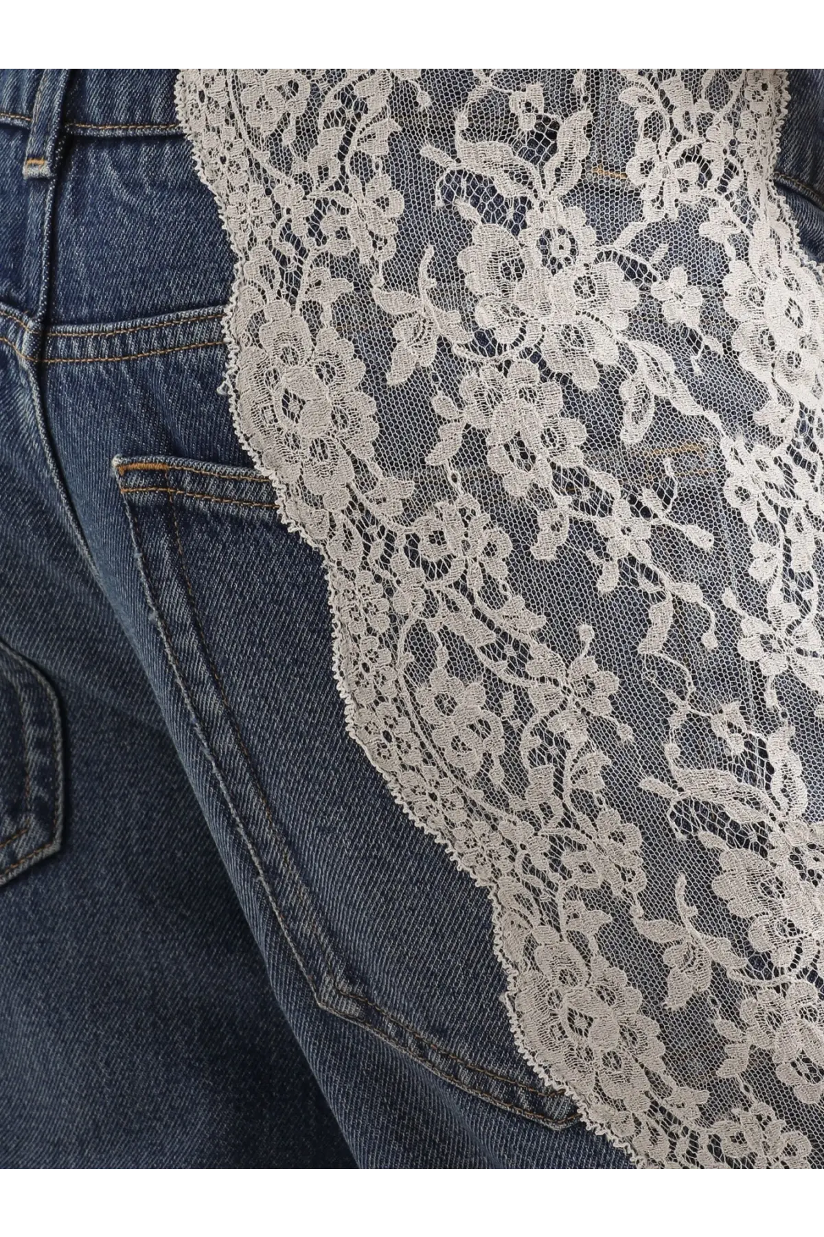 Dolce &amp; Gabbana women’s blue denim jeans featuring delicate cream floral lace overlay on dark blue denim fabric