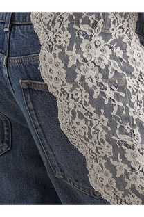 Dolce &amp; Gabbana women’s blue denim jeans featuring delicate cream floral lace overlay on dark blue denim fabric