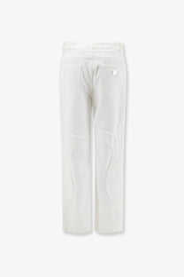 Dolce &amp; Gabbana women’s white denim trousers with subtle raised swirling embroidery along the outer legs
