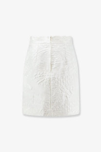 Dolce &amp; Gabbana women’s white brocade mini skirt featuring intricate embossed texture and detailed pattern