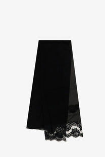 Black lace-trimmed midi skirt with sheer panels and flowing silhouette paired with dolce and gabbana black silk and cotton scarf