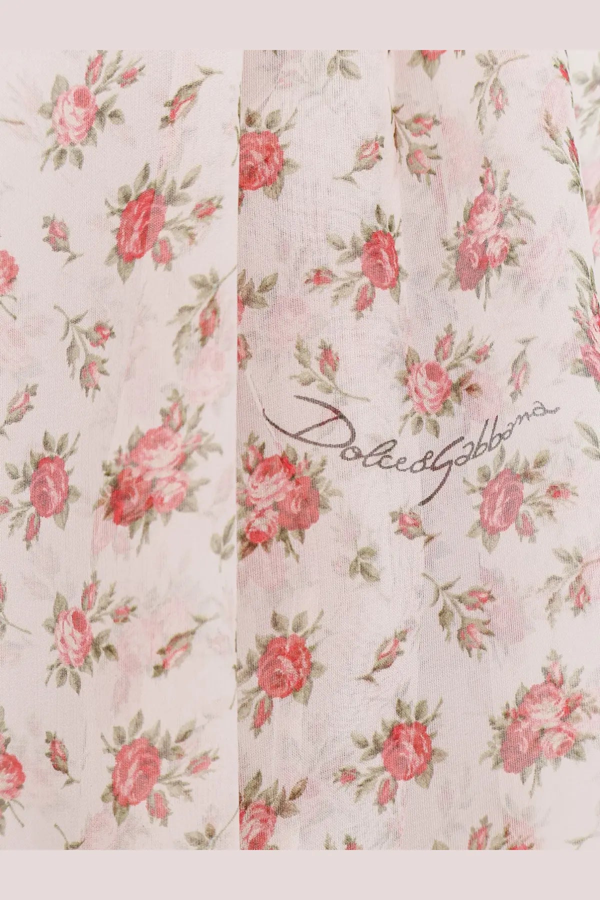 Dolce gabbana women’s chiffon shirt in pink with delicate pink and green floral print and subtle black signature stitching