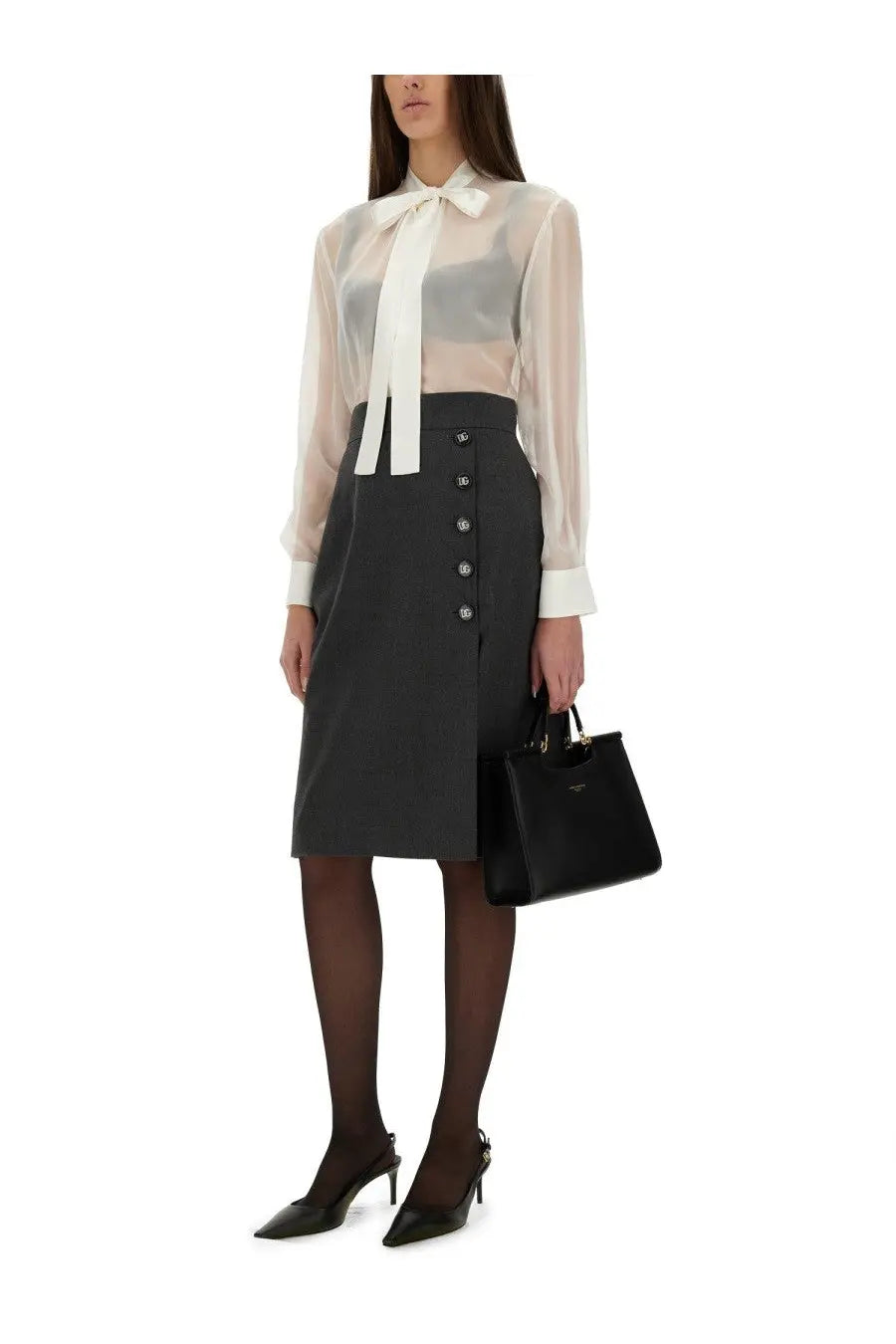 Black leather prada handbag with gold-tone hardware and minimalist design shown with dolce and gabbana white chiffon shirt