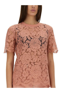 Dolce &amp; Gabbana women’s pink cordonetto lace top with short sleeves and round neckline featuring floral pattern