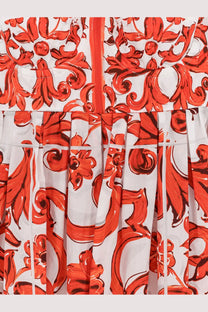 Dolce &amp; Gabbana women’s white cotton dress with bold red floral scrollwork and pleated skirt