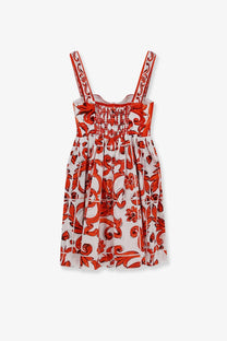 Dolce &amp; Gabbana women’s white cotton sleeveless dress with red floral pattern ornate scrollwork and smocked neckline