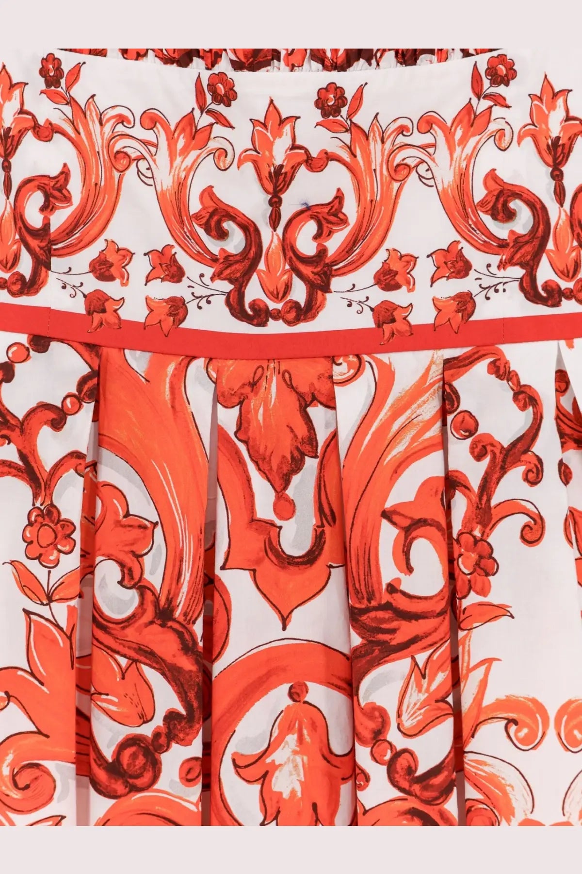 Dolce &amp; Gabbana women’s cotton long dress featuring a vibrant orange and white pleated skirt with baroque floral pattern