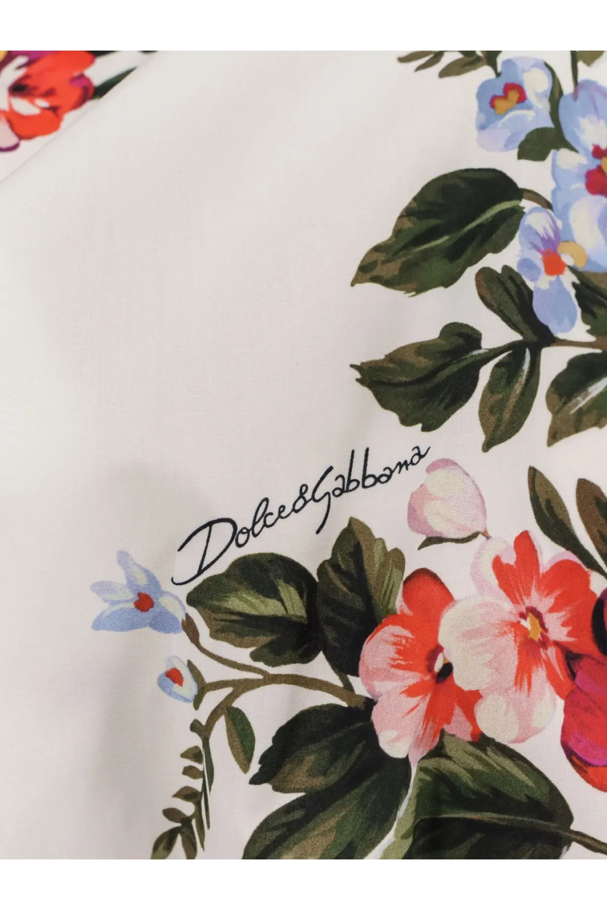 Dolce &amp; Gabbana women’s white cotton blouse with vibrant red pink and blue floral print and dark green leaves