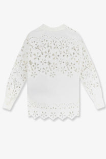 White cotton dolce and gabbana long-sleeved blouse with delicate floral eyelet embroidery on shoulders sleeves and hem