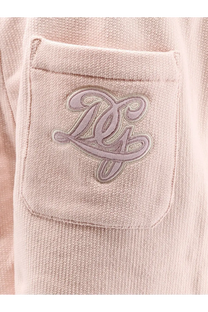 A soft pink textured cotton pocket on dolce &amp; gabbana women’s shorts with an embroidered lavender logo