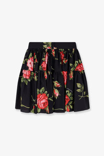Dolce &amp; gabbana women’s cotton skirt in black with vibrant red rose and green leaf floral print on soft flowing fabric