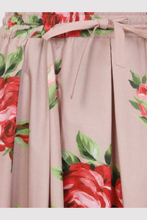 Dolce &amp; Gabbana women’s pink cotton skirt with elastic waistband and red rose floral pattern and fabric ties