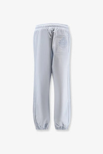 Back view of dolce &amp; gabbana women cotton light gray sweatpants with subtle embroidered logo on the back pocket