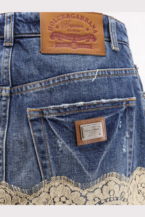 Dolce &amp; Gabbana women’s blue denim skirt with lace trim hem and brown leather branded patches on the back