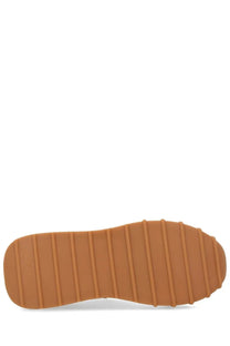 Back side of dolce &amp; gabbana women’s dg athletic sneaker beige with tan rubber sole featuring vertical grooves and jack &amp; jones branding