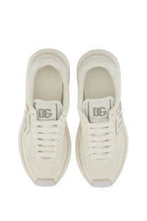 Cream-colored Dolce &amp; Gabbana women’s DG Cushion sneaker with chunky sole and subtle gray branding details