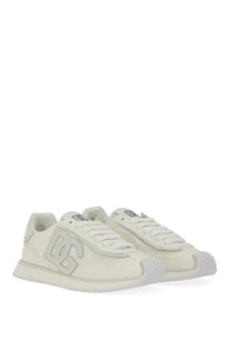 Dolce &amp; gabbana women’s white leather dg cushion sneakers with a prominent silver logo on the side