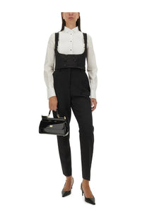 Black patent leather handbag with gold-tone hardware and rectangular flap closure for dolce and gabbana tuxedo vest