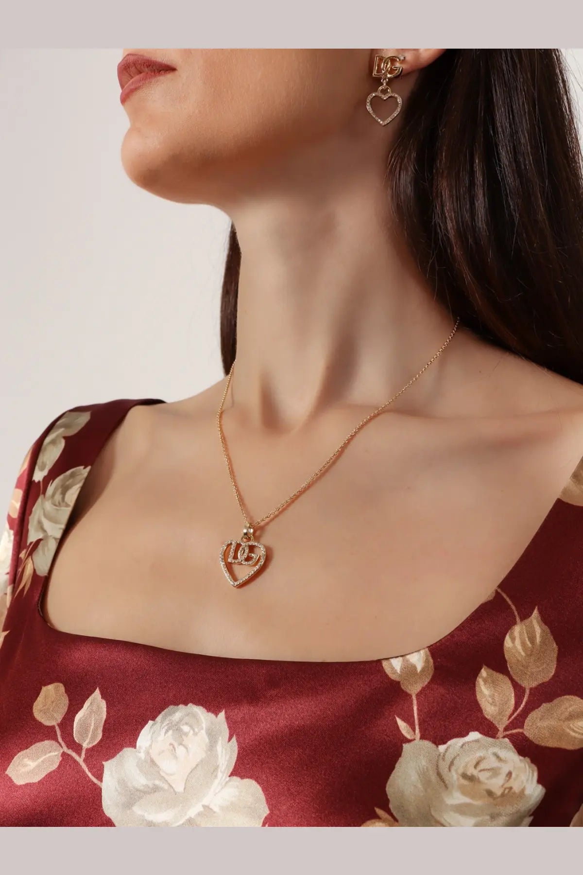 Dolce &amp; Gabbana women’s gold brass necklace featuring a gold heart pendant engraved with love and sparkling stones