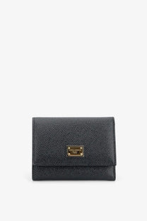 Dolce and Gabbana women’s black hammered leather wallet with gold-tone plaque and textured finish