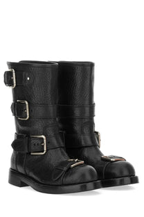 Dolce &amp; Gabbana women’s black leather biker boots with three silver buckle straps and textured surface
