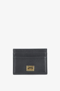 Dolce &amp; Gabbana women’s black leather card holder with gold-tone metal plaque front view