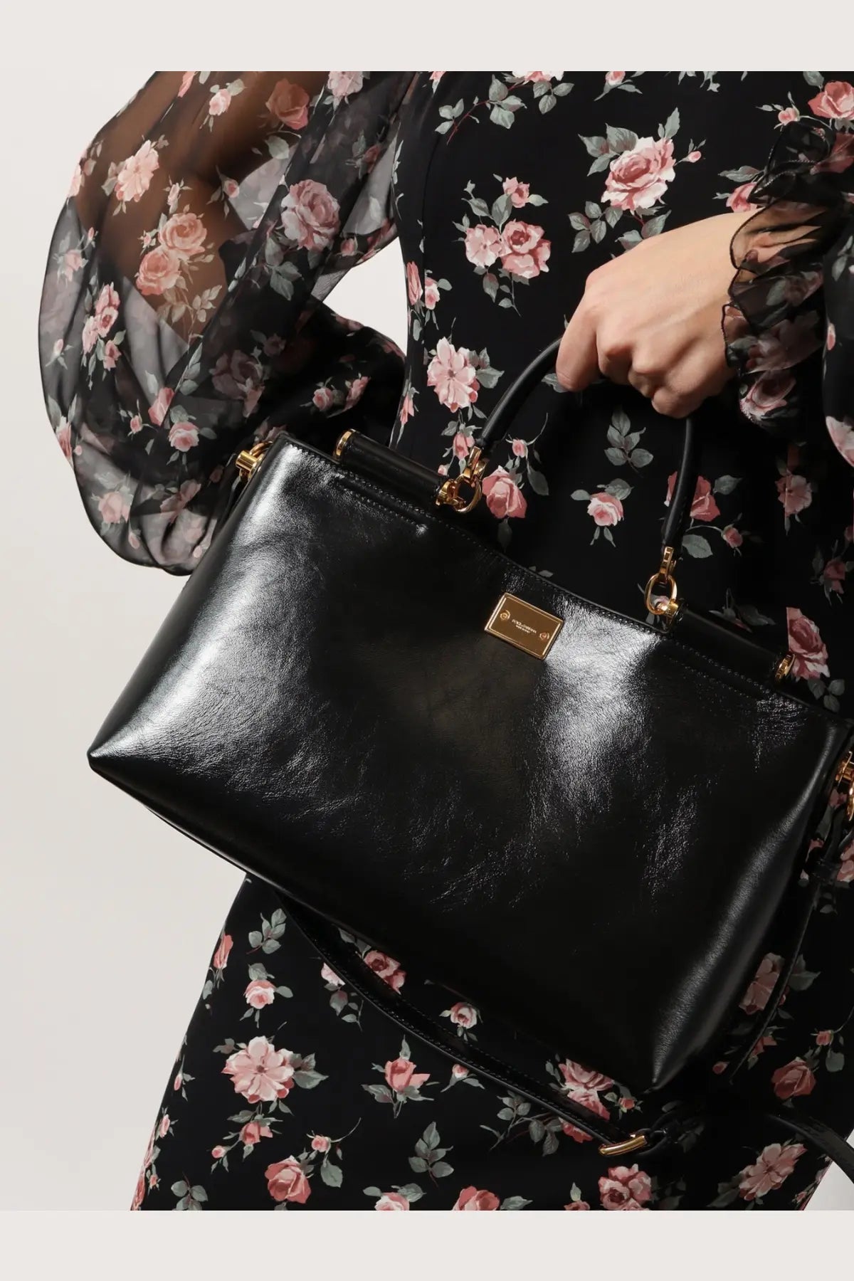 Dolce &amp; Gabbana women’s black patent leather crossbody bag with gold-tone hardware and rectangular plaque