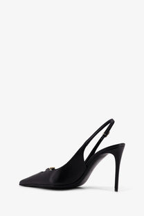 Dolce &amp; Gabbana women’s black leather pump with a black satin slingback and gold-tone logo detail at the toe