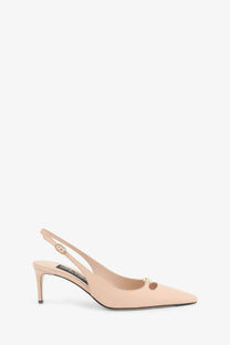 Dolce &amp; Gabbana women’s beige leather slingback pump with gold-tone buckle and decorative charm at the toe