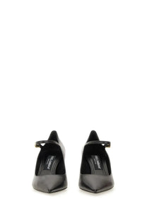 Dolce &amp; Gabbana women’s black leather mary jane pumps with gold-tone buckle showcasing elegant design
